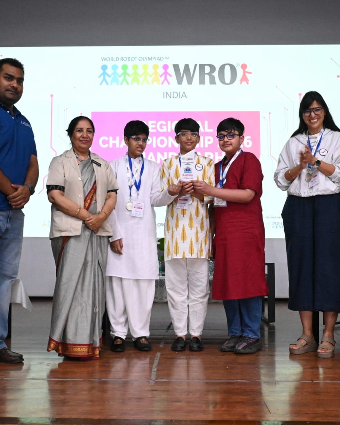 TheWorkshop students receiving recognition on stage at the WRO India Regional Championship 2026, Chandigarh.