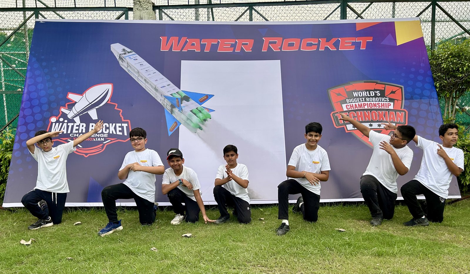 TheWorkshop students posing in front of the Water Rocket Challenge board at TechnoXian, the World's Biggest Robotics Championship.